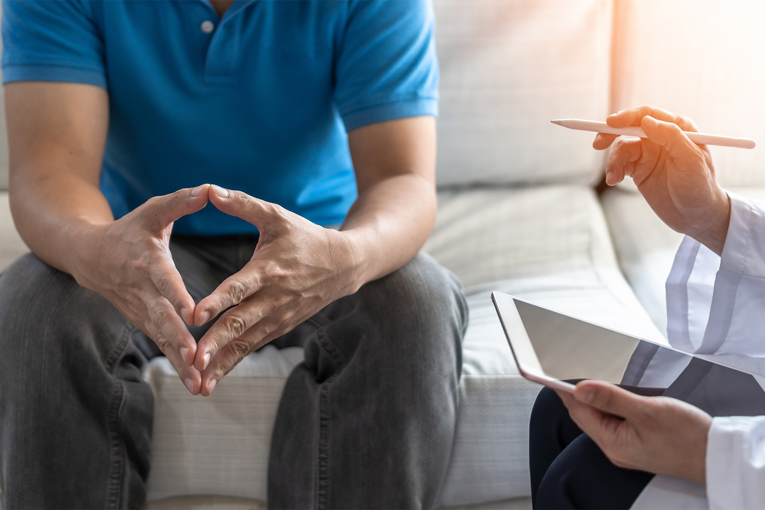 a nervous man listening to his doctor
