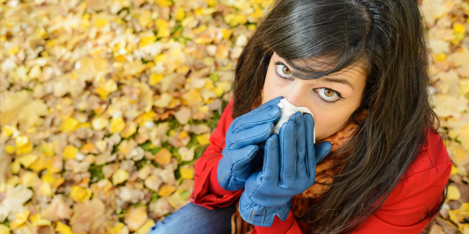 Woman sneezing