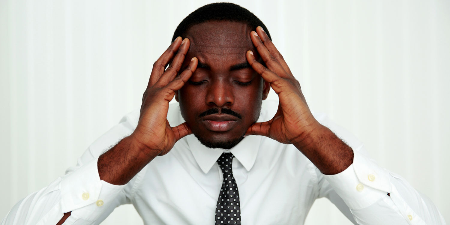A man trying to relax and ease his mind at work
