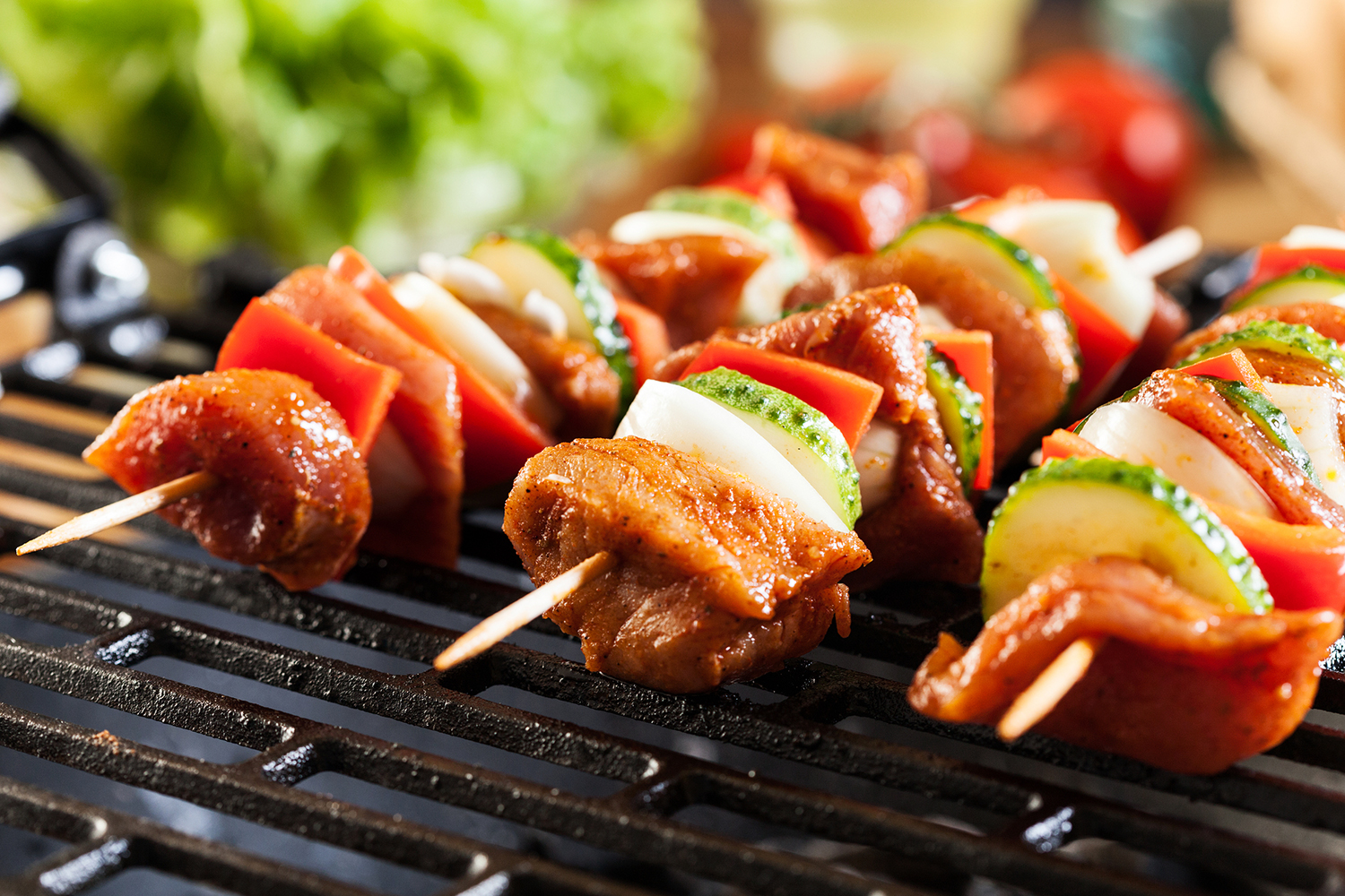 meat and cucumber shish kebabs on the grill