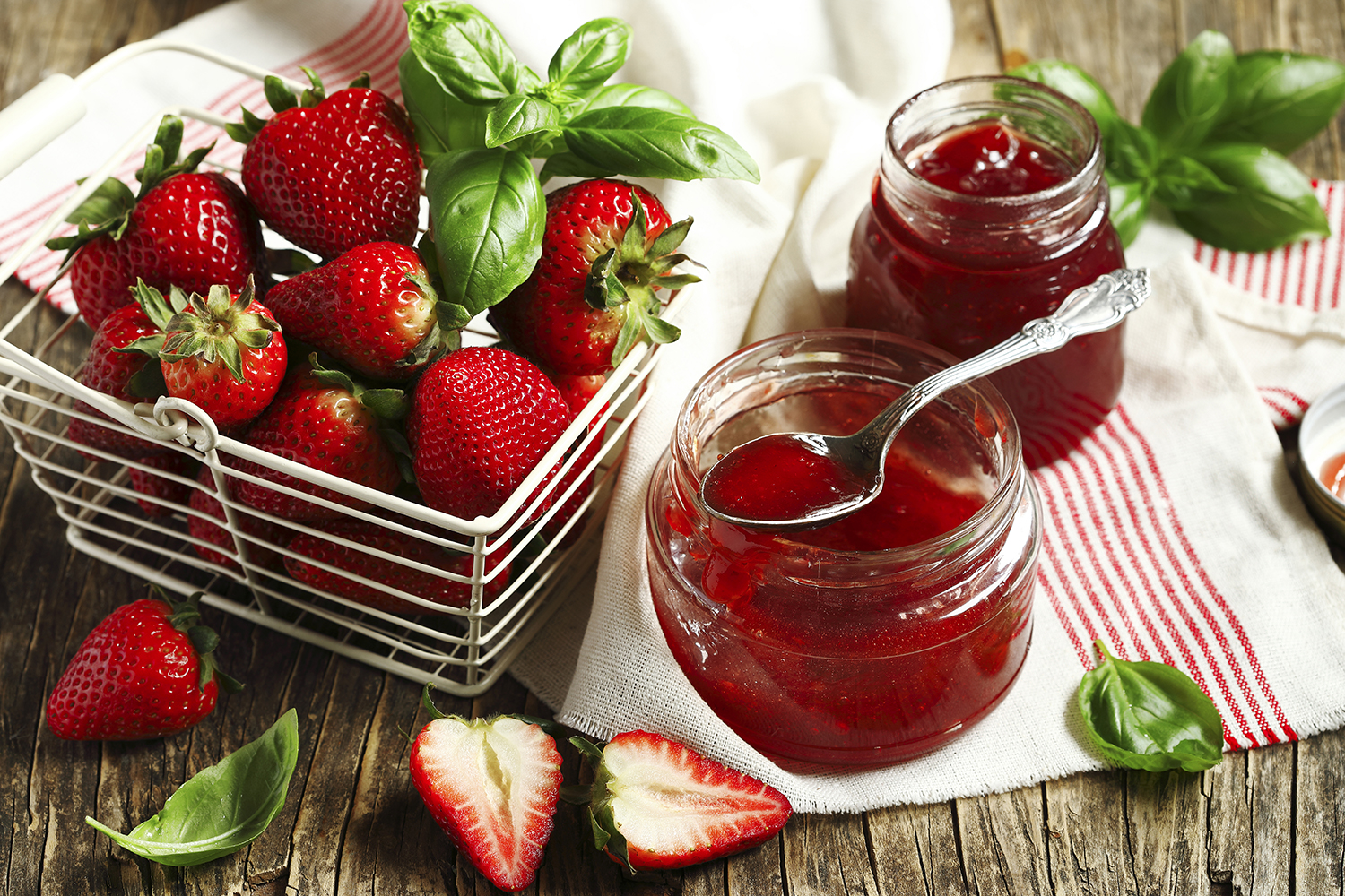 Fresh strawberries and basil leaves