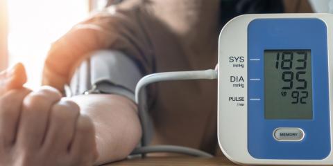 a woman checking her own blood pressure