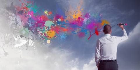 A man coloring over gray skies