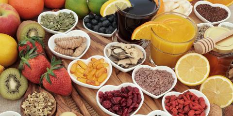 Superfoods for immunity collected in separate heart-shaped bowls.