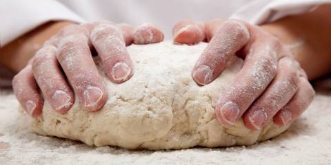 hands kneading bread