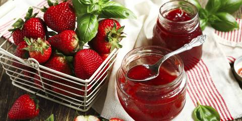 Fresh strawberries and basil leaves