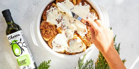 cinnamon buns being frosted