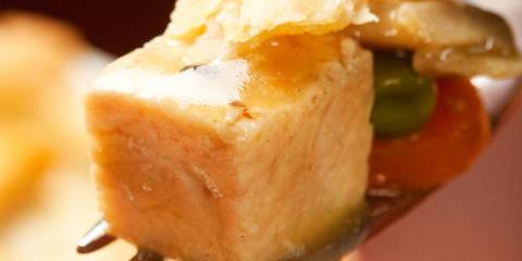 a forkful of turkey, flaky crust, and vegetables