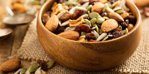 Trail mix in a wooden bowl. 