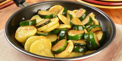 yellow and zucchini squash in a frying pan