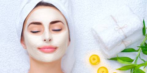 a woman enjoying a relaxing facial mask
