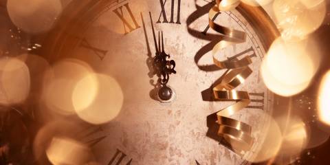 An old clock about to strike midnight