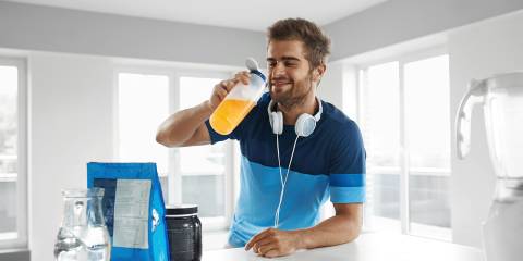 a man drinking supplements mixed in water
