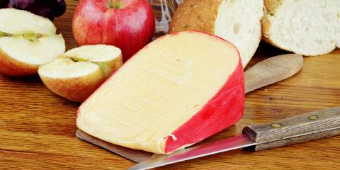 sliced apples, a paring knife, and a block of cheese