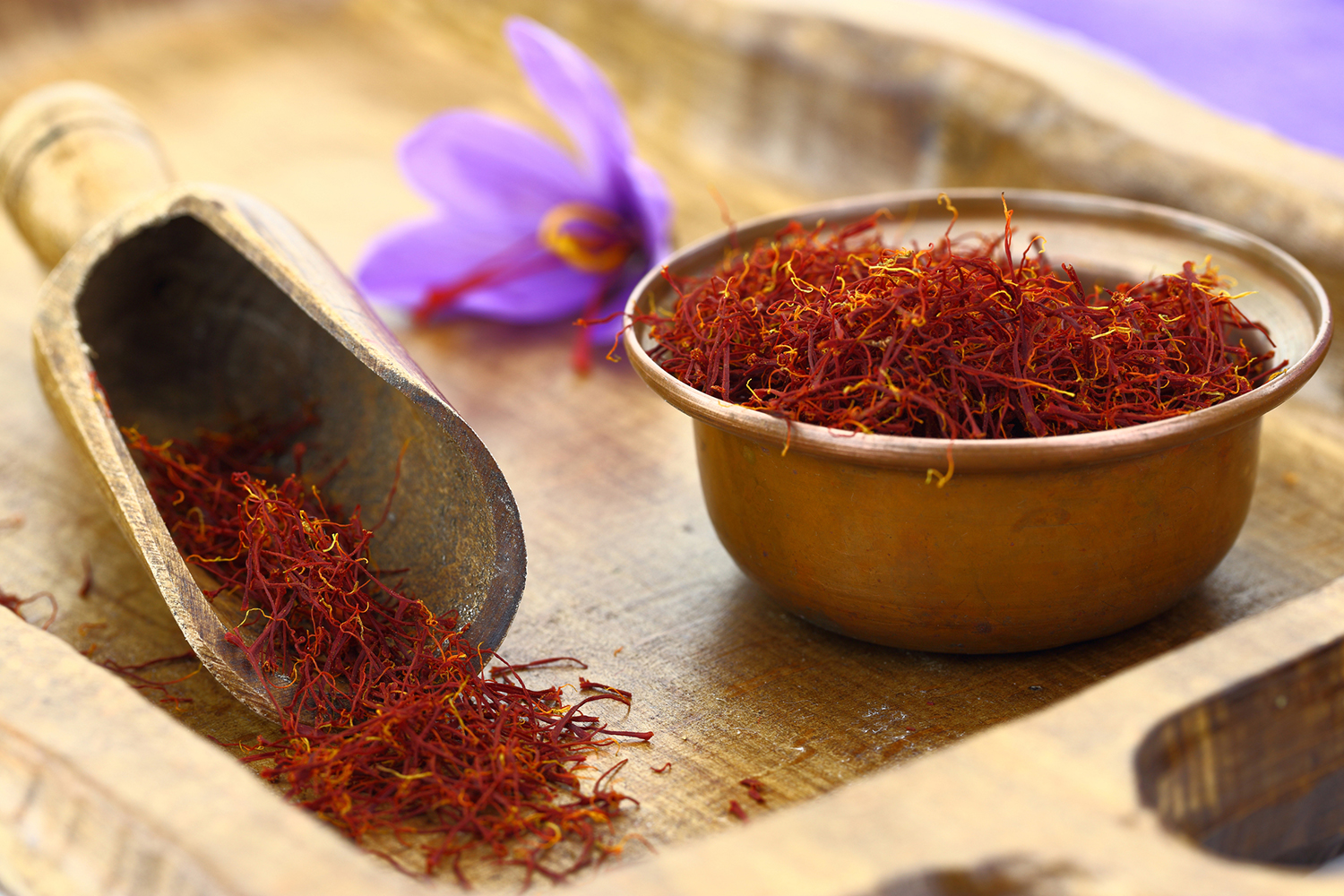 saffron threads in a bowl on a cutting board